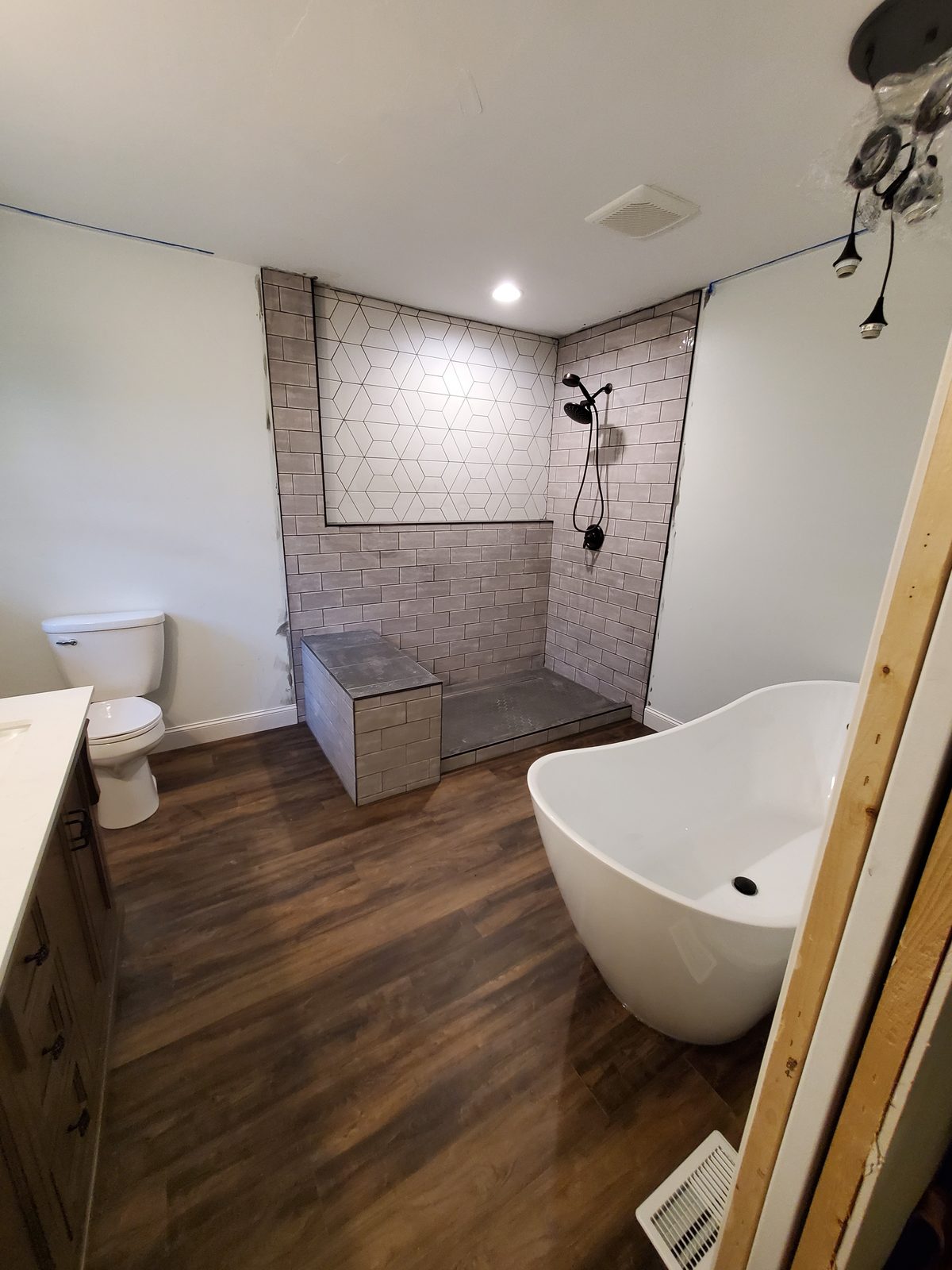 Freestanding tub and subway-tile walk-in shower