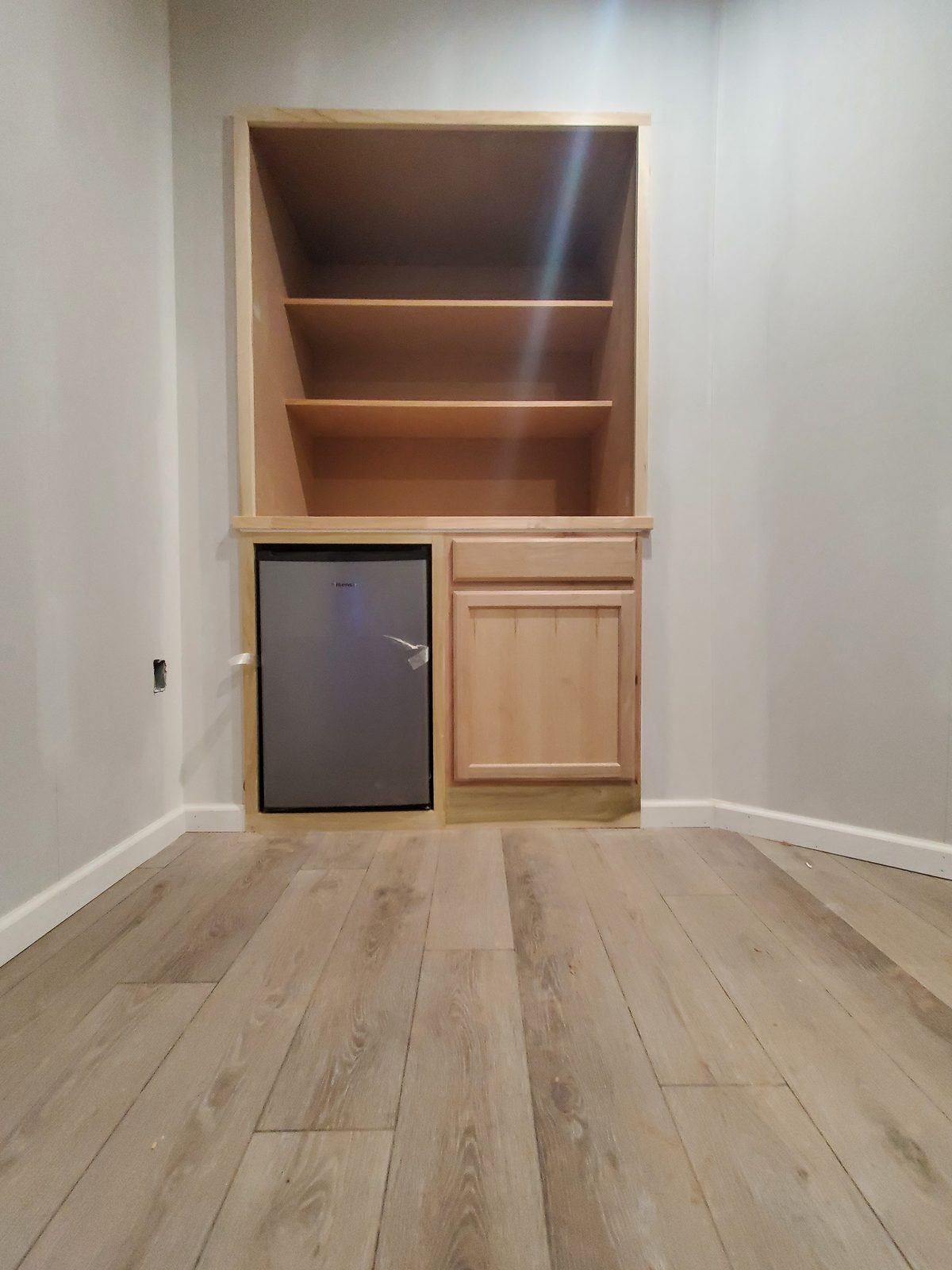Custom built-in shelving and beverage center