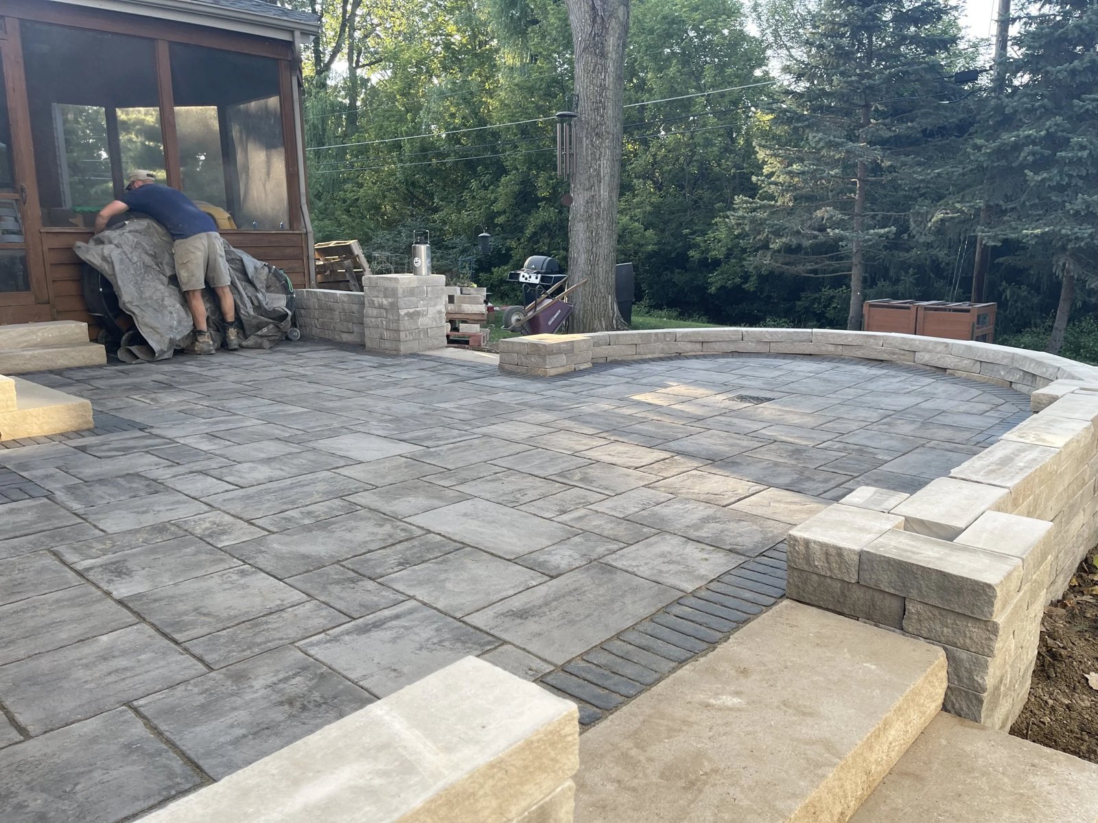 Paver patio and seat wall under construction