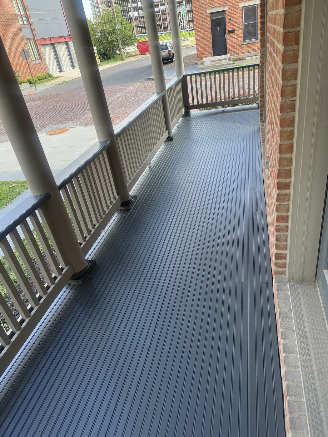 Rebuilt porch with new tongue and groove floor, level and freshly painted