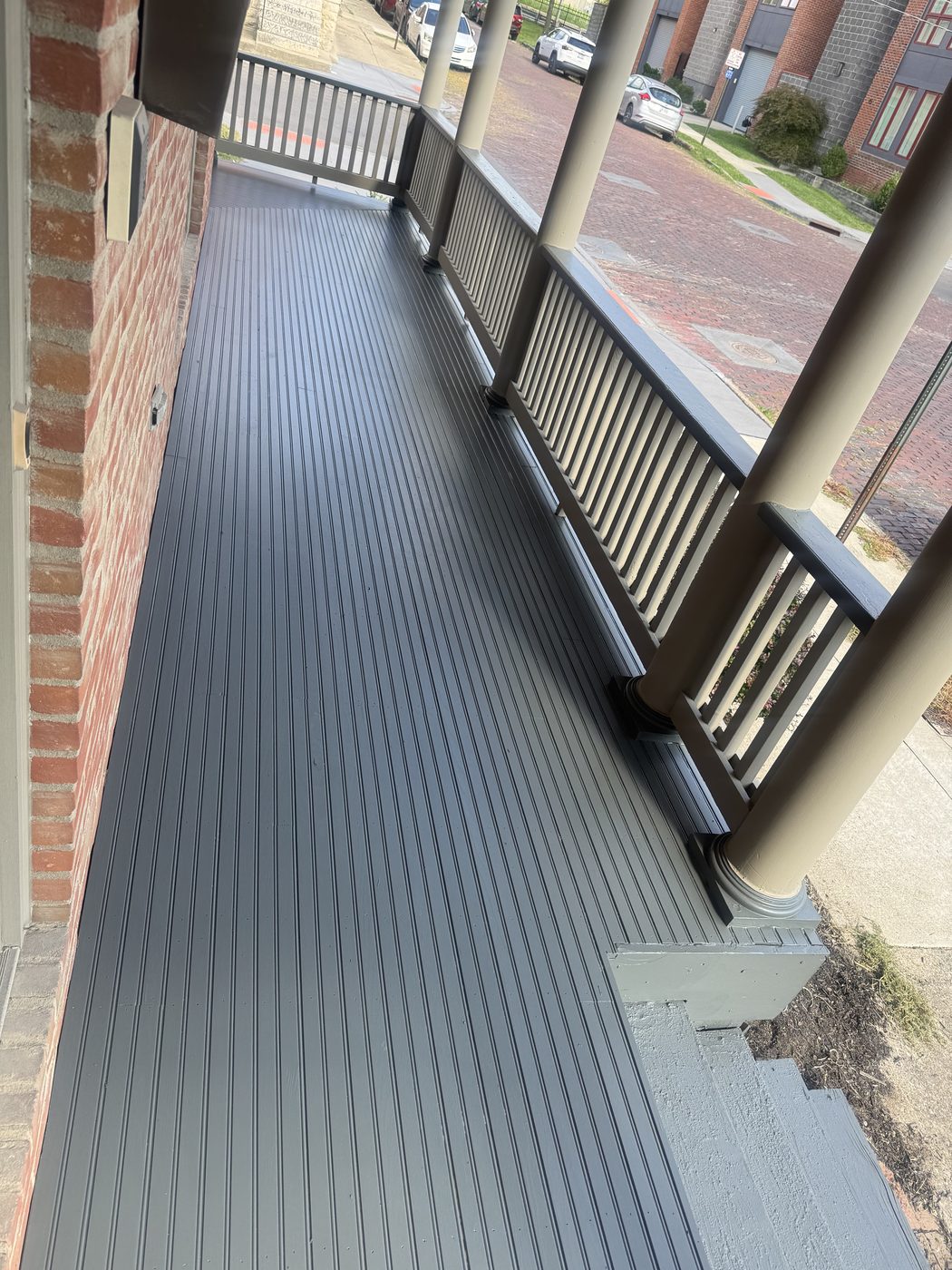 Finished wrap around porch with new painted tongue and groove floor and original columns