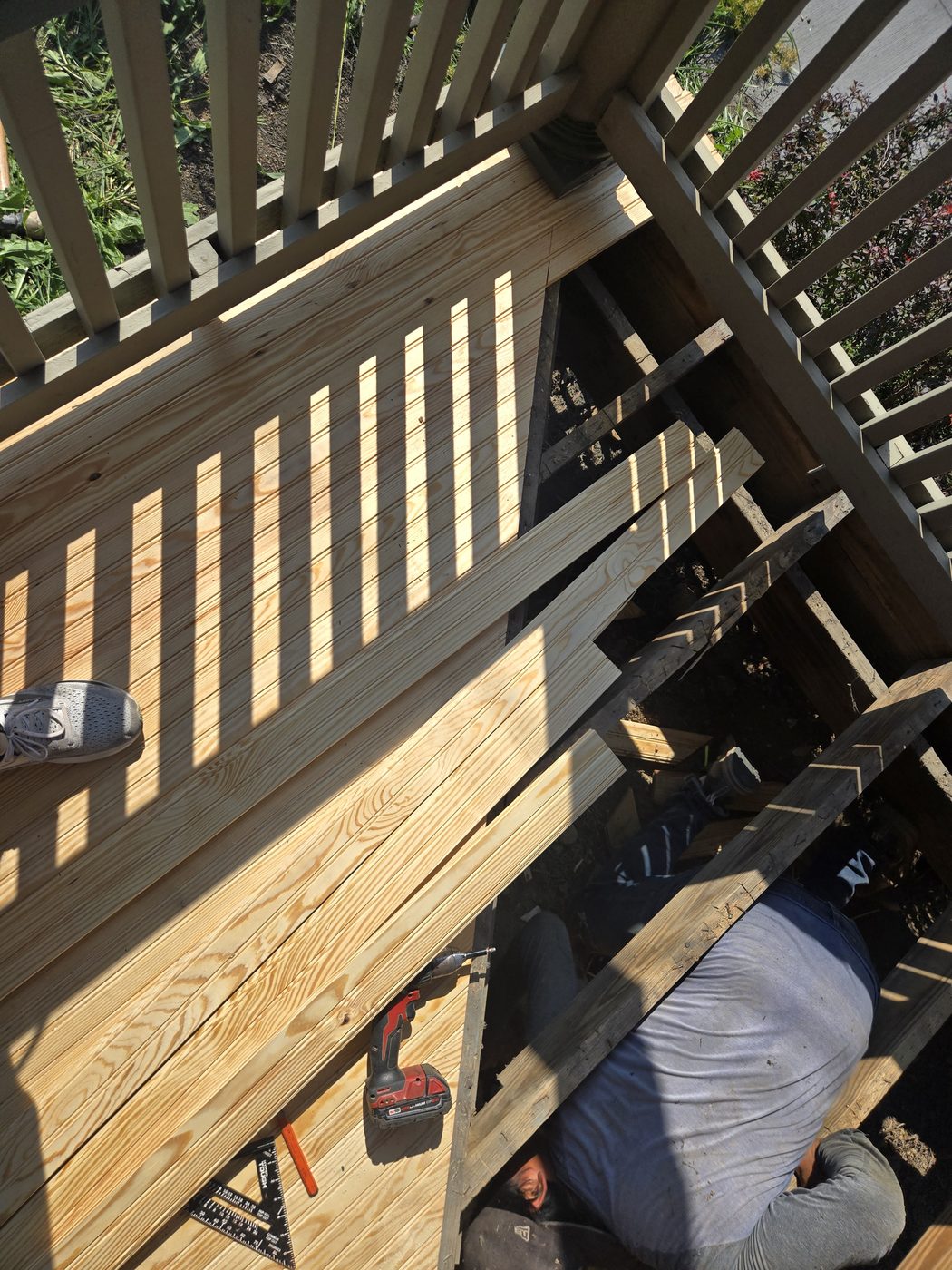 New tongue and groove pine porch boards being installed